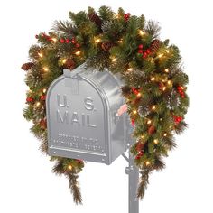 a mailbox decorated with christmas wreath and lights