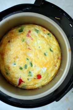 an omelet in a crock pot on the stove