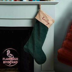 a christmas stocking hanging from a fireplace mantel