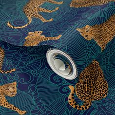 a blue and gold wallpaper with leopards on it