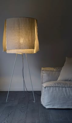 a lamp that is sitting next to a couch