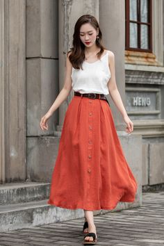 "DETAIL * 100% Linen * Two side pockets * Back elastic waist * Button down skirt * Button front skirt * Below Knee Length * A Line skirt, Midi skirt * Perfect for Spring, Summer and Autumn * Wash by hand or machine with cold water * Model's belt is not sale item * The model is 170 cm (5′ 7″) tall with a 80 cm (31.5\") bust, 66 cm (26\") waist. She is wearing in size XS. CUSTOM MADE SERVICE If you * Change other color * Can't find your size in our size Chart * Change the Style * Change the length Summer Midi Pleated Pencil Skirt, Buttoned Maxi Skirt For Spring, Buttoned Long Skirt For Day Out, Chic Long Skirt With Buttons, Long Skirt With Buttons For Day Out, Long Skirt With Button Closure For Day Out, Relaxed Full Skirt With Buttons, Spring Relaxed Skirt With Buttons, Flowy Buttoned Maxi Skirt For Summer