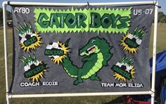 a gator doo banner is displayed in the grass