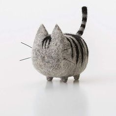 a cat made out of wool with the word woonya on it's back