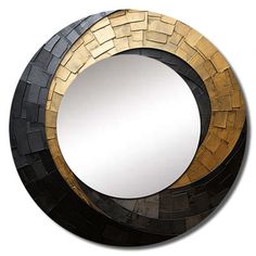 a round mirror made out of black and gold tiles