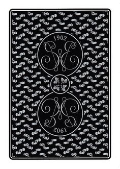 a black and white playing card with an ornate design