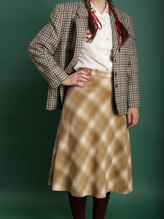 70s Vintage plaid wool winter midi skirt in beige Large W32 - A-shaped secretary, business, work, office, smart casual skirt - Similar to 30s and 40s style - Light weight, very soft fabric; lined - Zip side closure - High-waisted - Brand: Josselyne - 70% wool, 27% polyamid, 3% other; lining 100% viscose - Excellent vintage condition - Estimated size L (tag size EU42), please see the exact measurements! ✿ MEASUREMENTS (taken flat) ✿ 29" / 74 cm length 16'' / 40.5 cm waist Model usually is wearing Classic Fall Skirt For Business Casual, Elegant Plaid Skirt For Work, Winter Office Lady Skirt, Classic Winter Pencil Skirt, Classic Winter Skirt For Workwear, Classic Winter Office Skirt, Classic Fall Office Skirt, Classic Office Skirt For Winter, Beige Wool Skirt For Workwear