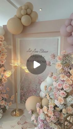 a room filled with lots of balloons and flowers