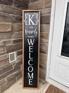 a welcome sign in front of a brick building with the words k is for koshery family