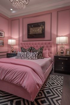 a bedroom with pink walls, black and white rugs and a chandelier