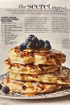 a stack of pancakes with blueberries on top