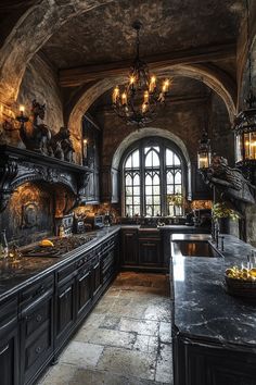 an old fashioned kitchen with black cabinets and marble counter tops, chandelier above the stove