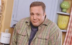 a man standing in front of a kitchen counter