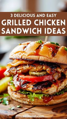 grilled chicken sandwich on a wooden cutting board with pickles and tomatoes in the background