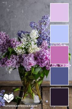 a vase filled with purple and white flowers