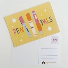 a postcard with two pencils on it and the words pen pals written in cursive writing