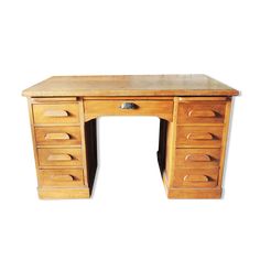 an old wooden desk with drawers on the top and bottom drawer open, against a white background