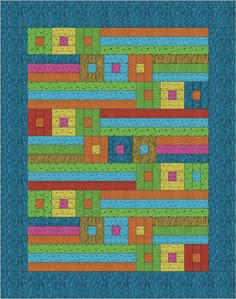 a blue quilt with multicolored squares and lines in the center, on top of it