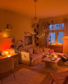 a living room filled with furniture next to a window