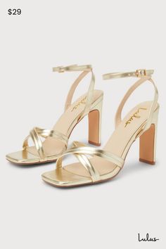 Your Saturday night 'fit just got a little more glamorous thanks to a wow-worthy look like the Lulus Milanii Gold Square Toe Ankle Strap High Heel Sandals! Make a statement wherever you go with these shiny faux leather heels that feature a single sole silhouette, a square toe bed, and crisscrossing toe straps. Matching straps sprout from the sides to wrap and secure around the ankle with a shiny gold buckle. A flirty blade heel lends a trendy finishing touch! 4" wrapped blade heel. Lightly cushioned insole. Rubber sole has nonskid markings. Man Made Materials. Imported. Lulus | Milanii Gold Square Toe Ankle Strap High Heel Sandal Heels. Gold Sandals With 4-inch Heel For Date Night, Cute Gold Heels, Gold Sandals With Padded Heel For Date Night, Gold Heels With Padded Heel For Date Night, Gold Block Heel For Date Night, Gold Block Heel Heels For Date Night, Glamorous Gold Heels For Date Night, Gold Heels For Summer Date Night, Short Gold Heels