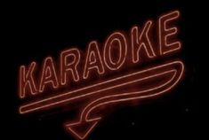 a neon sign that says karaoke on it