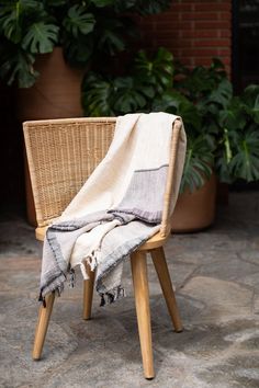 a chair with a blanket on top of it