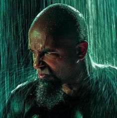 a man in the rain with his eyes closed