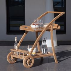 a wooden cart with drinks on it