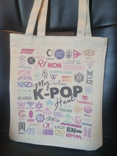 This tote is made of a cotton-polyester blend. Sublimation printed. Filled with the logos of many of K-pop's popular groups.   If there is a logo you don't see, let me know and a special version can be made. About the Design:   This is my own design, created by me.  Use of this design is copyrighted and prohibited without permission.  If you have any questions, please feel free to ask me. Returns/Exchanges: At this time, I cannot accept returns but would gladly offer an exchange.  Item must be r Kpop White Cotton Bag, White Cotton Kpop Style Bag, What Is Kpop, Stray Kids Outfits, Kpop Diy, Picnic Baskets, 17 Kpop, Funny Quotes For Instagram, Insulated Bags