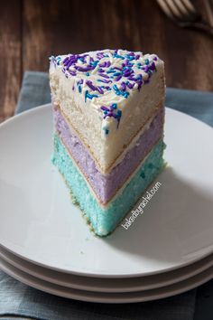 a slice of cake with sprinkles sits on a plate