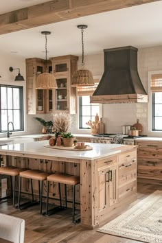 a large kitchen with wooden cabinets and an island