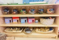 the shelves are filled with different types of toys and crafts for children to play in