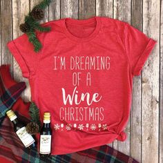 i'm dreaming of a wine christmas t - shirt with two bottles of wine next to it