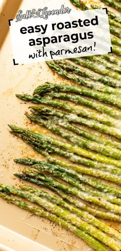 roasted asparagus with parmesan on a baking sheet, ready to be cooked