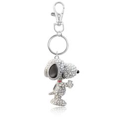 a key chain with a dog on it's face and some diamonds around the neck