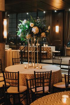 a table with candles and flowers on it