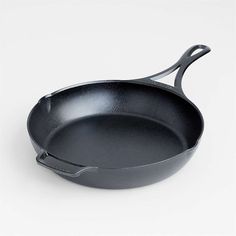 an empty cast iron skillet on a white background