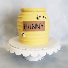 a cake made to look like a beehive with the word humny on it