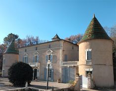 an old building with two towers on top