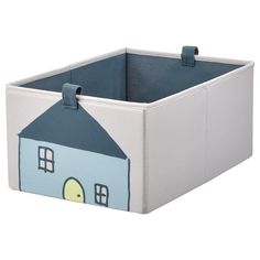 a toy storage box with a house design on the front and sides, in blue and white