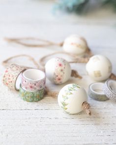 an assortment of decorated eggs and rings on a table