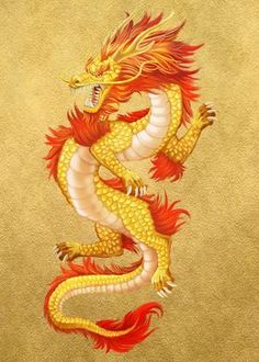 a yellow and red dragon sitting on top of a table