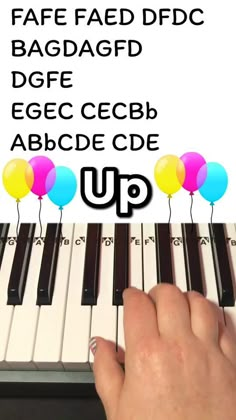 someone is playing the piano with balloons on it, and there are words above them