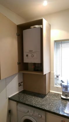 a washer and dryer in a small kitchen