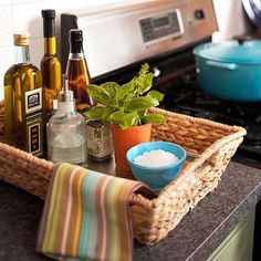 an image of a kitchen counter top with spices and bottles on it, including herbs