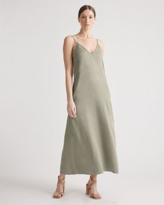 All of the elegance, none of the effort. Our vintage wash maxi slip dress is super soft to the touch and made with Lyocell, a biodegradable fabric made from the cellulose found in wood pulp. Not only does it require less water to produce, it’s wrinkle-, shrink- and static-resistant. With an easy drape and relaxed fit, it’s a flattering pick for date night or a weekend afternoon. Just add a few accessories and go  | Quince | Women's Vintage Wash Tencel Maxi Slip Dress in Olive, Tencel Woven, Size Silk Pajama Pants, Staple Dress, Maxi Slip Dress, Quince Dresses, Maxi Tank Dress, Linen Clothes, Stunning Dresses, Quince, Vintage Skirt