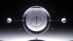 an image of a glass object with four balls in the middle and three circles around it