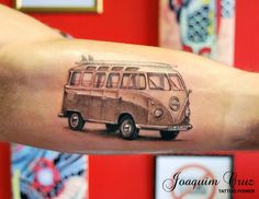 an old school bus tattoo on the arm