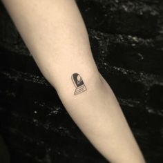 a person with a small tattoo on their arm