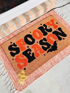 a door mat with the words boo's boo - boo on it sitting in front of a doorway